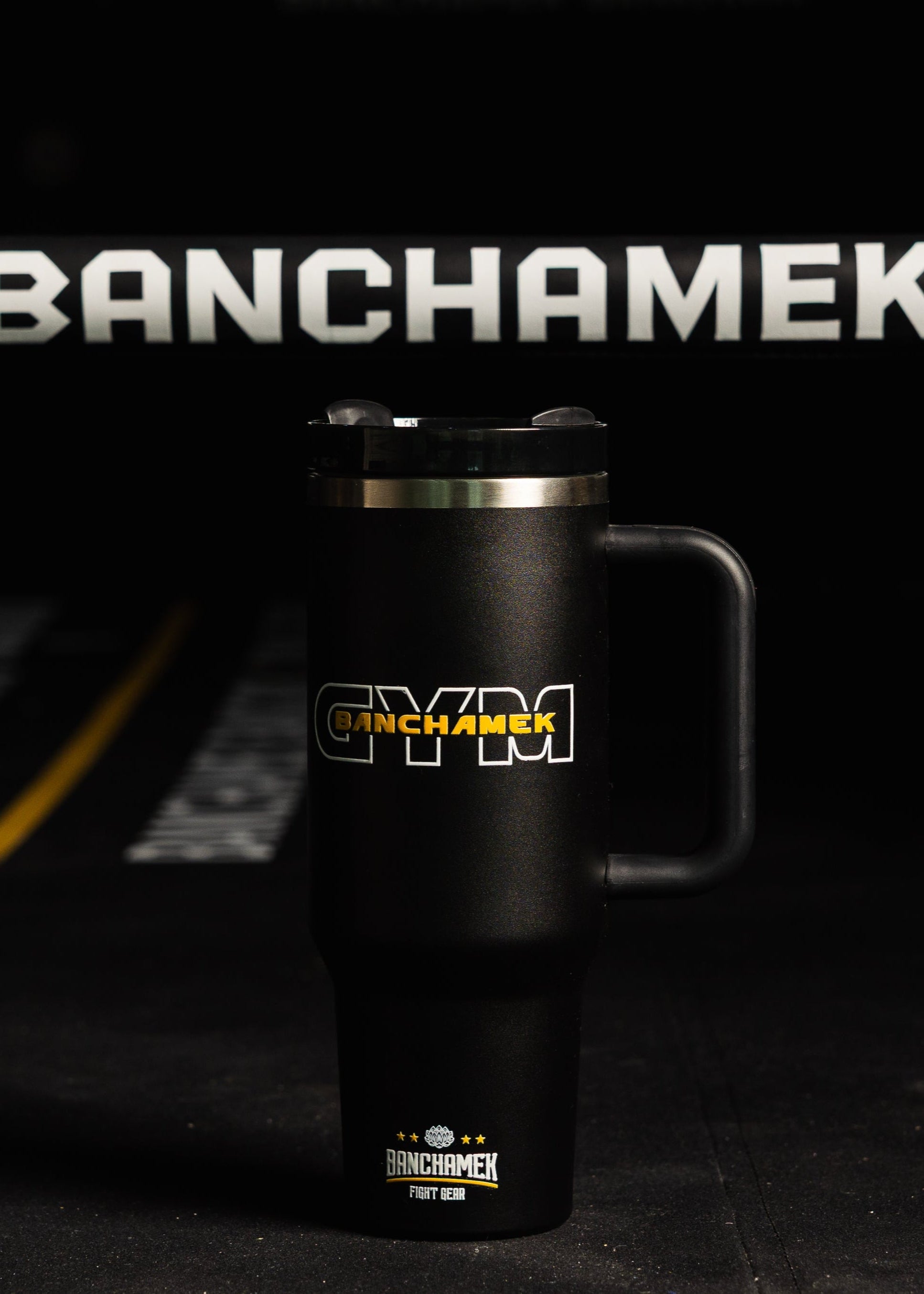 Black mug with 'Banchamek Gym' branding on a dark background