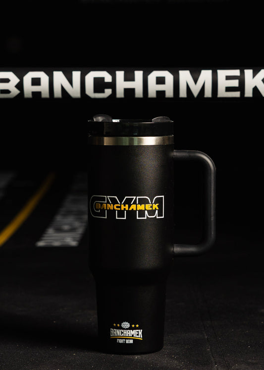 Black mug with 'Banchamek Gym' branding on a dark background